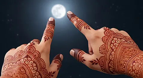 Elegant henna design on hands in luxury lighting